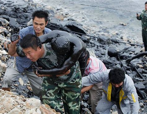 Shocking Pictures Of Man Almost Drowning In Oil Slick On The Yellow Sea