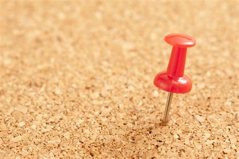 Free Image Of Close Up Red Pin On Brown Cork Board Freebiephotography