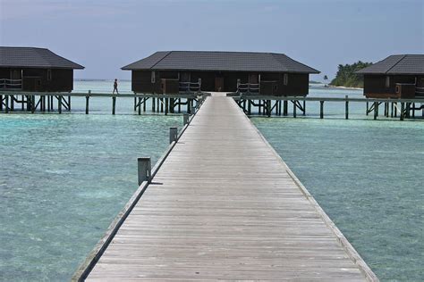 Beach Huts Wooden Houses Built On The Water Maldives Photograph By Jean