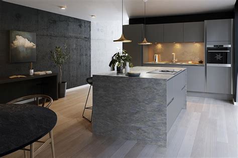 These grey kitchen cabinets have an elegant feel due to the feet on the sink cabinetry. Dark kitchens: black, navy and dark grey kitchen ideas ...