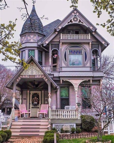 An Old Victorian House With Pink And Purple Accents