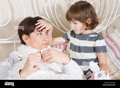 Daughter Taking Care Of Sick Mother Stock Photo Alamy