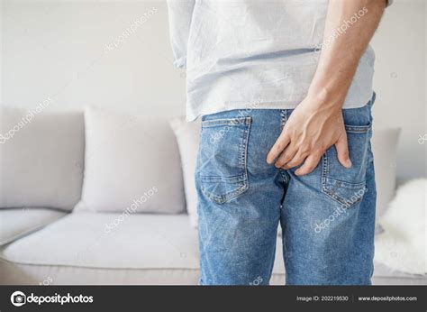 Man Holding His Bottom Pain Isolated Grey Man Hemorrhoids Holding Stock Photo By Dragana Stock