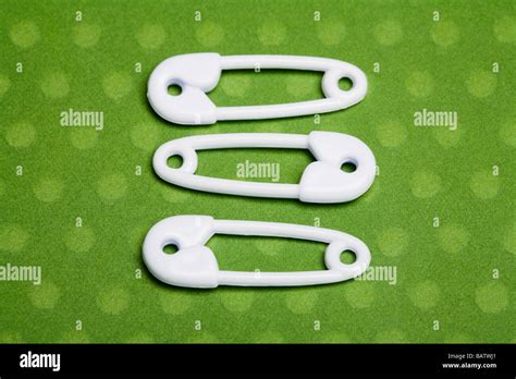 Three Safety Pins Stock Photo Alamy
