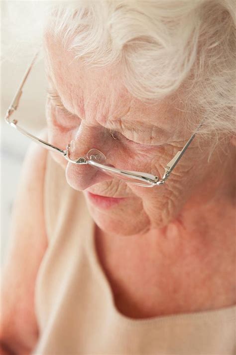 Elderly Woman Using Reading Glasses Photograph By Cristina Pedrazzini Science Photo Library
