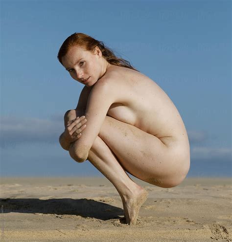Nude Babe Woman Squating On Beach By Stocksy Contributor Rene De Haan Stocksy