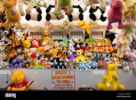 Rows Of Cuddly Toys Being Offered As Prizes On A Fairground Stall At A