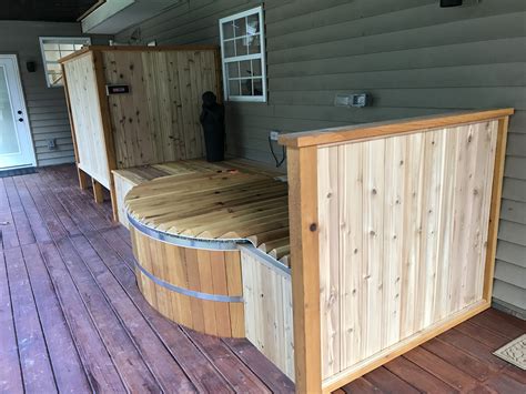 An Oval Cedar Hot Tub From Canadian Hot Tubs Built Into A Deck Hot