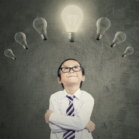 Creative Boy With Lightbulb Over Head Stock Photo Image Of Asian