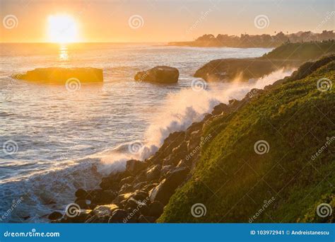 Waves Crushing On The Rocky Shoreline At Sunset Santa Cruz California