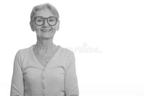 Studio Shot Of Happy Senior Nerd Woman Smiling While Wearing Geeky