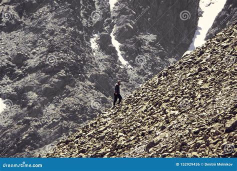 Man Climbing Steep Mountain Good Image For Adventure Struggle And