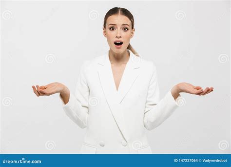 Shocked Confused Woman Posing Isolated Over White Wall Background Stock