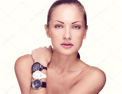 Close Up Portrait Of A Beautiful Woman With Watches In Fashion Makeup