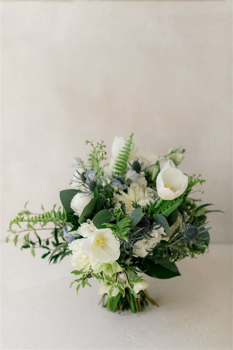 White Ivory Greens And Pops Of Blue White Bouquet Blue Delphinium
