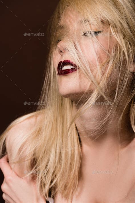 Seductive Naked Blonde Woman Posing On Brown Stock Photo By Lightfieldstudios