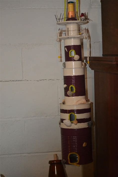 Here are 50 business ideas for vacant land. Light House Made with Tin Cans. | Tin can lights, Bottle ...