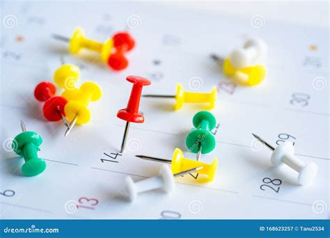 Close Up Calendar With Numbers Marked With Red Push Pins Stock Image