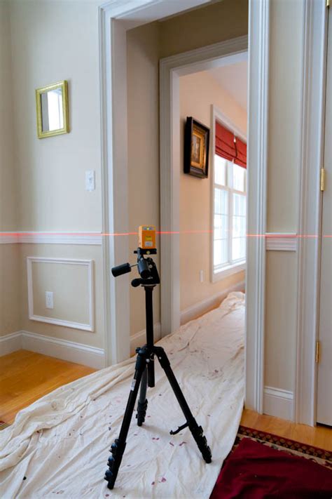 Chair rail molding will be measured, sized, and finished. Installing chair rail with a laser level | PLS 180