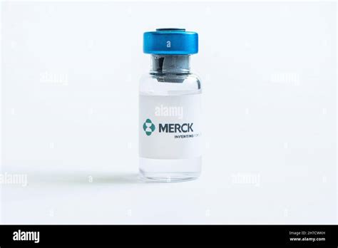 Vials Of Liquid On A White Table And The Logo Merck Large