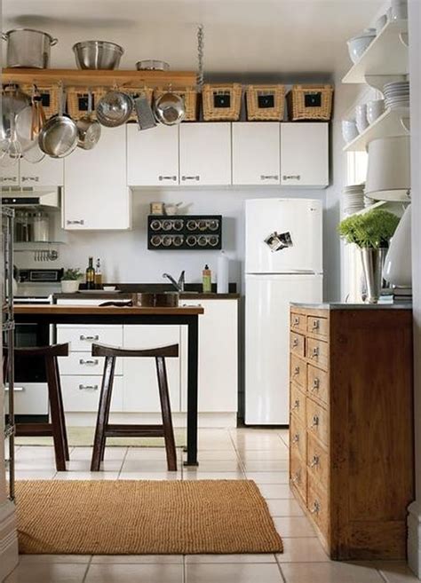 Sitting atop four raised legs, the pieces also feature a durable granite countertop and a glossy modern white finish, accentuated with shiny bronze pulls. 5 Ideas for Decorating Above Kitchen Cabinets