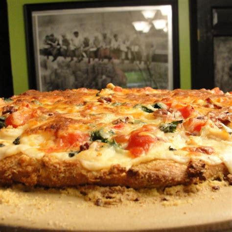 Top the pizza with the mozzarella and fontina cheese and the sliced chicken. Chicken Alfredo Pizza