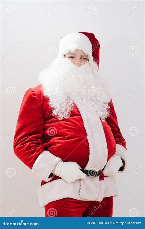 Pot Bellied Santa Claus Held By His Hands For A Belt Stock Image