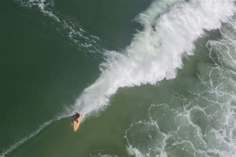 High Angle View Of Man Surfing In Sea Id 114923046