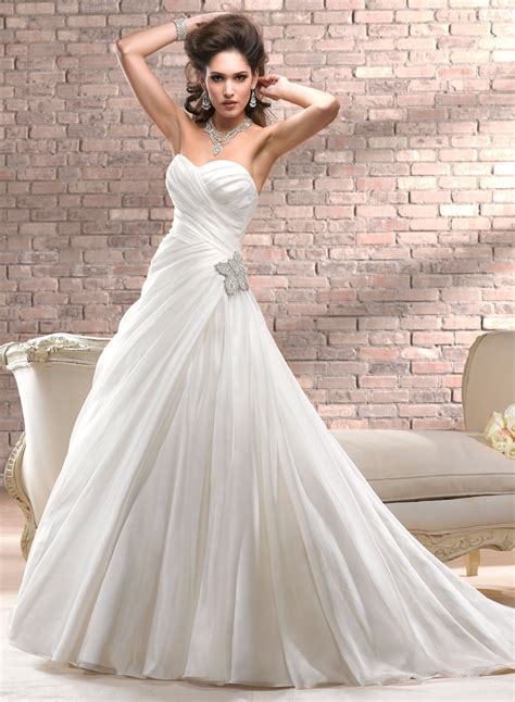 Beautifully detailed with lace and a dazzling swarovski crystal belt, the fitted bodice of this ball gown cascades into a romantic tulle skirt. Maggie Sottero Spring 2013 Divina Bridal Wedding Dresses ...