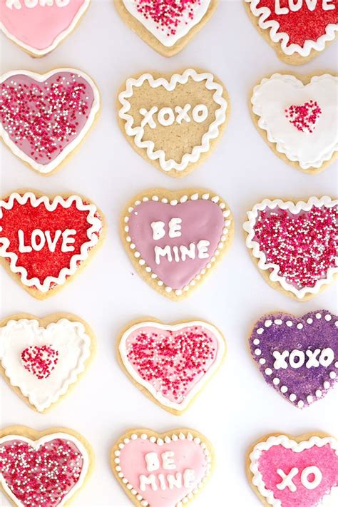 Decorated Heart Shaped Cookies With The Words Be Mine Written On Them