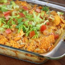 In a greased or sprayed 9x13 casserole dish, layer 1/2 of the crushed dorito's, all of the diced chicken, all of the cream of mushroom soup, all of the cream of chicken soup, all of the the rotel. Dorito Chicken Casserole Recipe