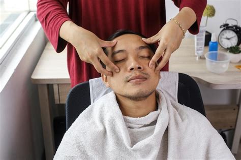 Premium Photo Man Having Face Massage In Spa Salon