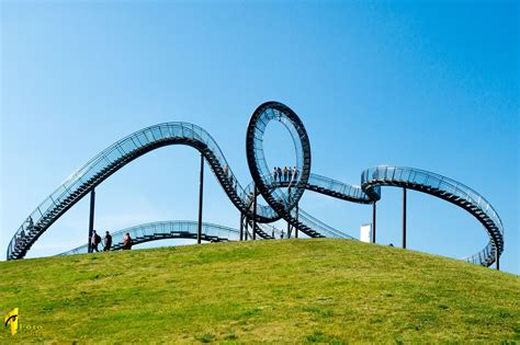'tiger and turtle,' which looks like a roller coaster, is illuminated in duisburg, germany. Tiger and Turtle - Magic Mountain