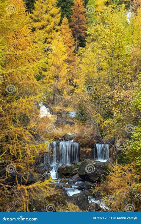 Incredible Autumn Landscape With Waterfalls In The Forest In Dolomites