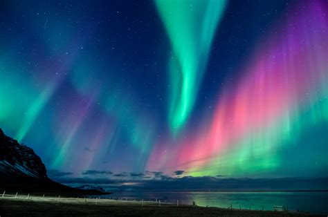 Northern Lights In All The Colors Of The Rainbow Dance Across The Sky