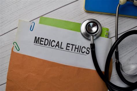Medical Ethics Text With Document Brown Envelope And Stethoscope