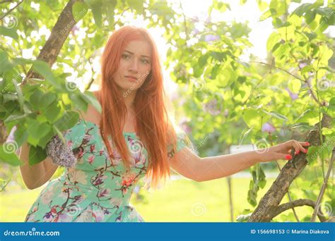 Pretty Redheaded Girl Walking In The Summer Park Stock Image Image Of