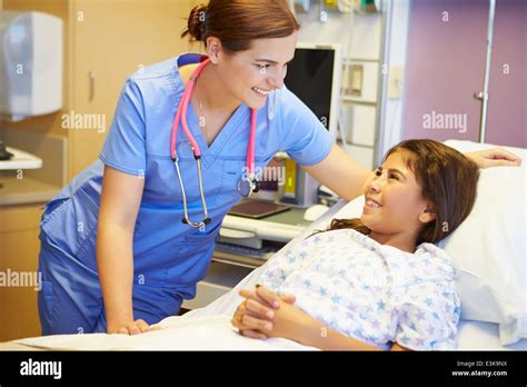 Young Girl Talking To Female Nurse In Hospital Room Stock Photo Alamy