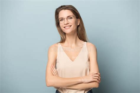 Portrait Of Smiling Millennial Woman Posing In Glasses Stock Image
