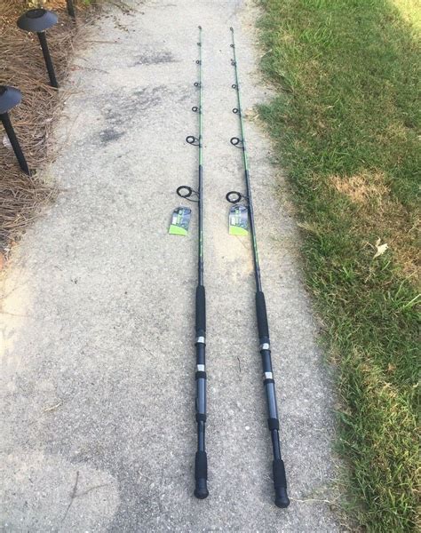 2 NEW Zebco Bite Alert 7 2pc Spinning Fishing Rod Medium Heavy 17