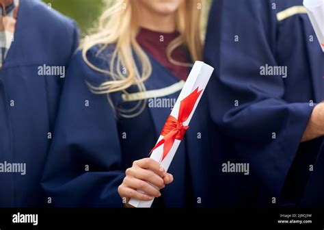 Graduate Students In Mortar Boards With Diplomas Stock Photo Alamy