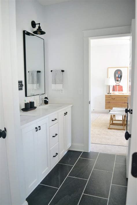 This elegant bathroom features black and white marble. A Black and White Bathroom That Never Gets Old - Chrissy ...