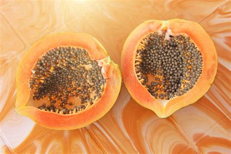 Orange Open Papaya With Black Seeds Papaya Close Up Stock Photo