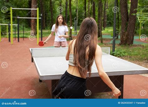 Table Tennis In Park Two Girls Playing With Ping Pong Rackets Stock Image Image Of Game