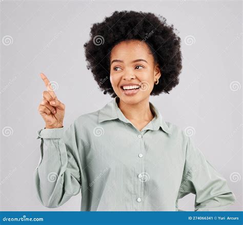 Black Woman Thinking Point And Idea With A Smile In A Studio With A