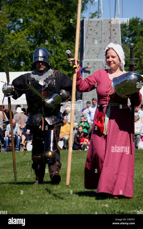 A Battle Re Enactment With A Male Knight And A Female Defending Herself