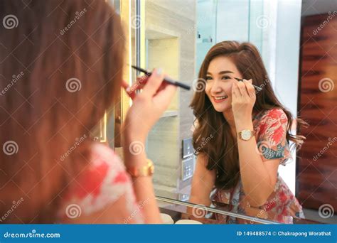 Woman Getting Ready For Work Doing Morning Makeup Routine Putting