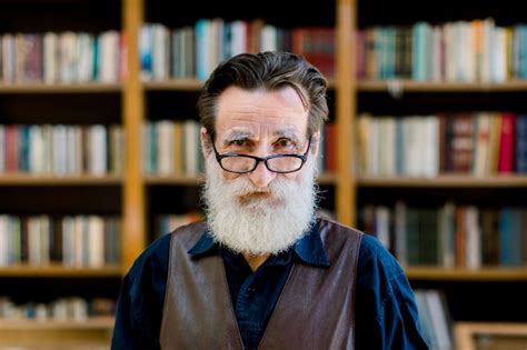 Premium Photo Portrait Of Senior Man With Beard And Eyeglasses Looking At Camera Standing On