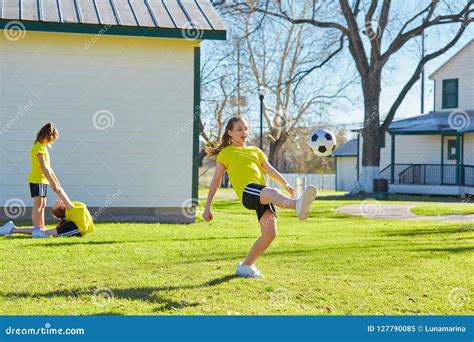 Friend Girls Teens Playing Football Soccer In A Park Stock Image