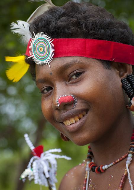 portrait of a smiling tribal woman in traditional clothing milne bay province trobriand island